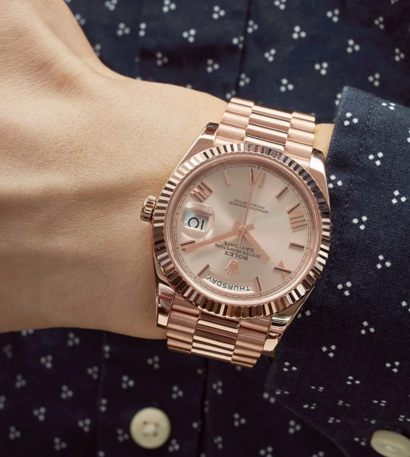 Day-date rose gold sundust roman dial 40mm